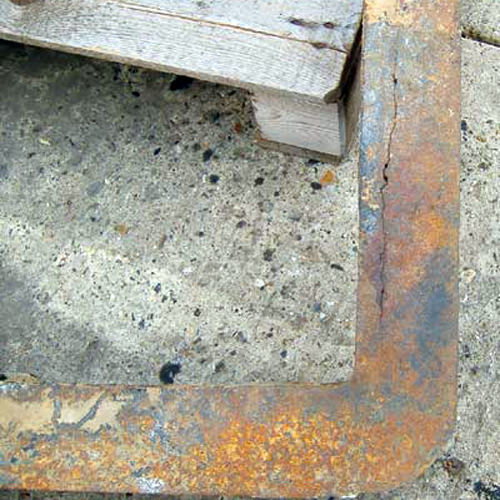 Previously installed failed E600 manhole cover frame