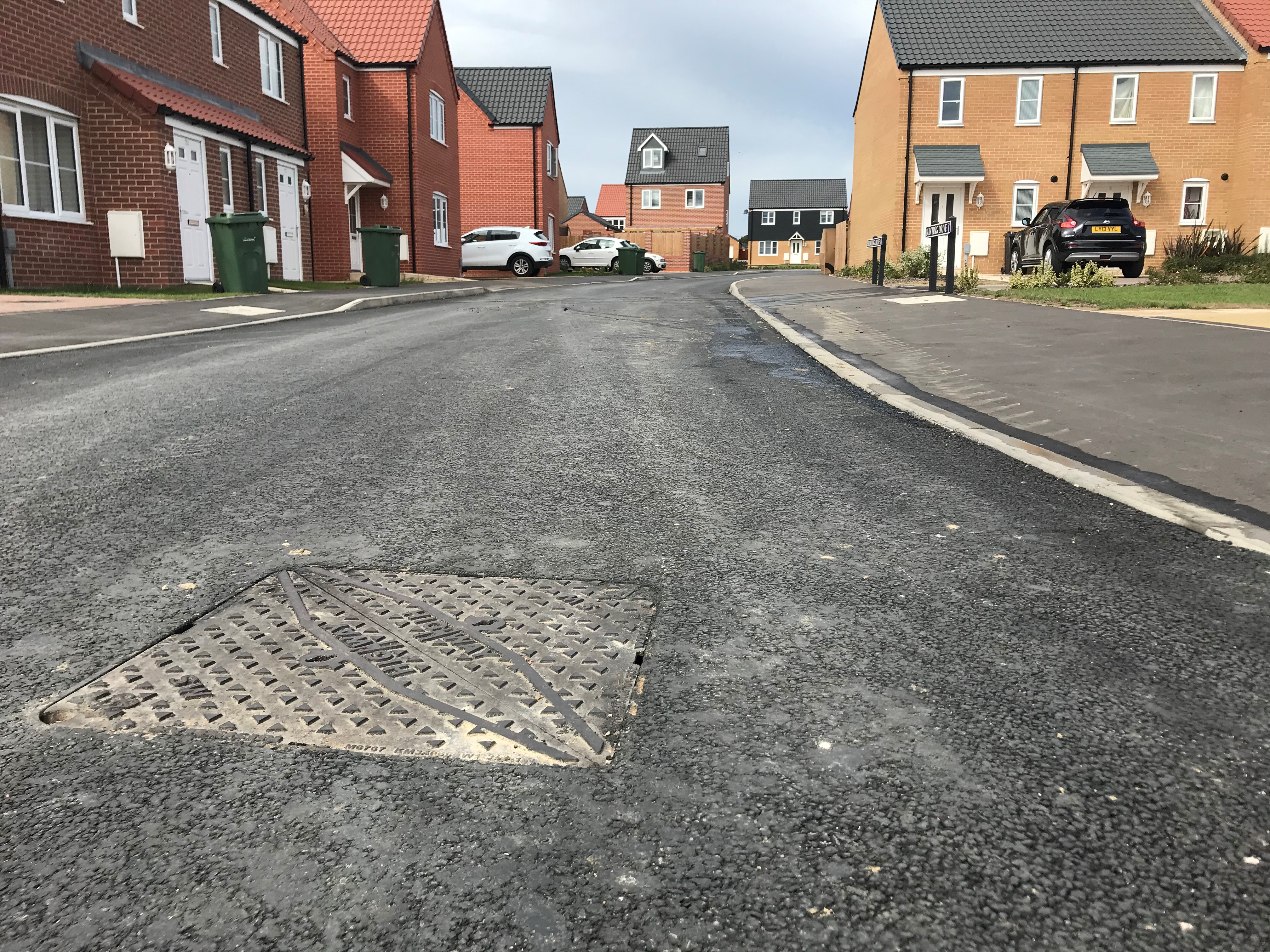 Highway D400 manhole cover installed in road