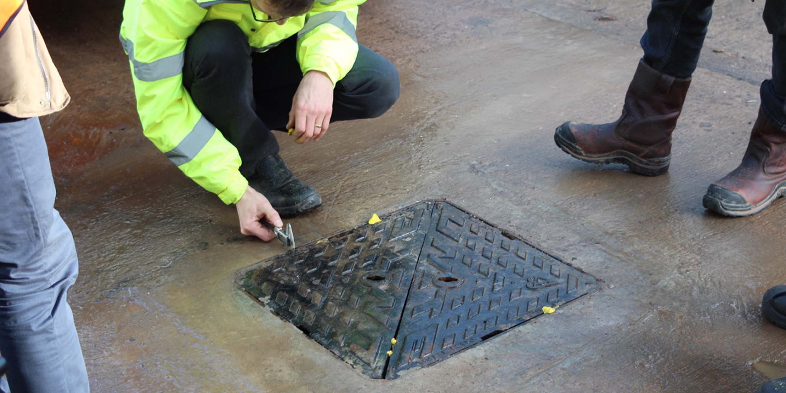 Unite manhole cover being installed