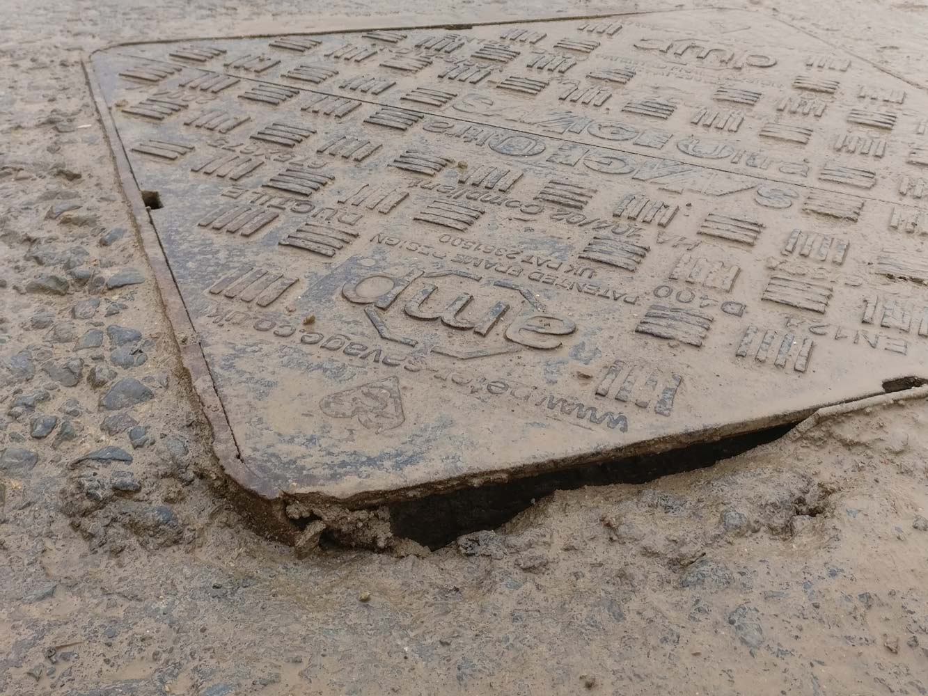 Manhole cover exposed to damage