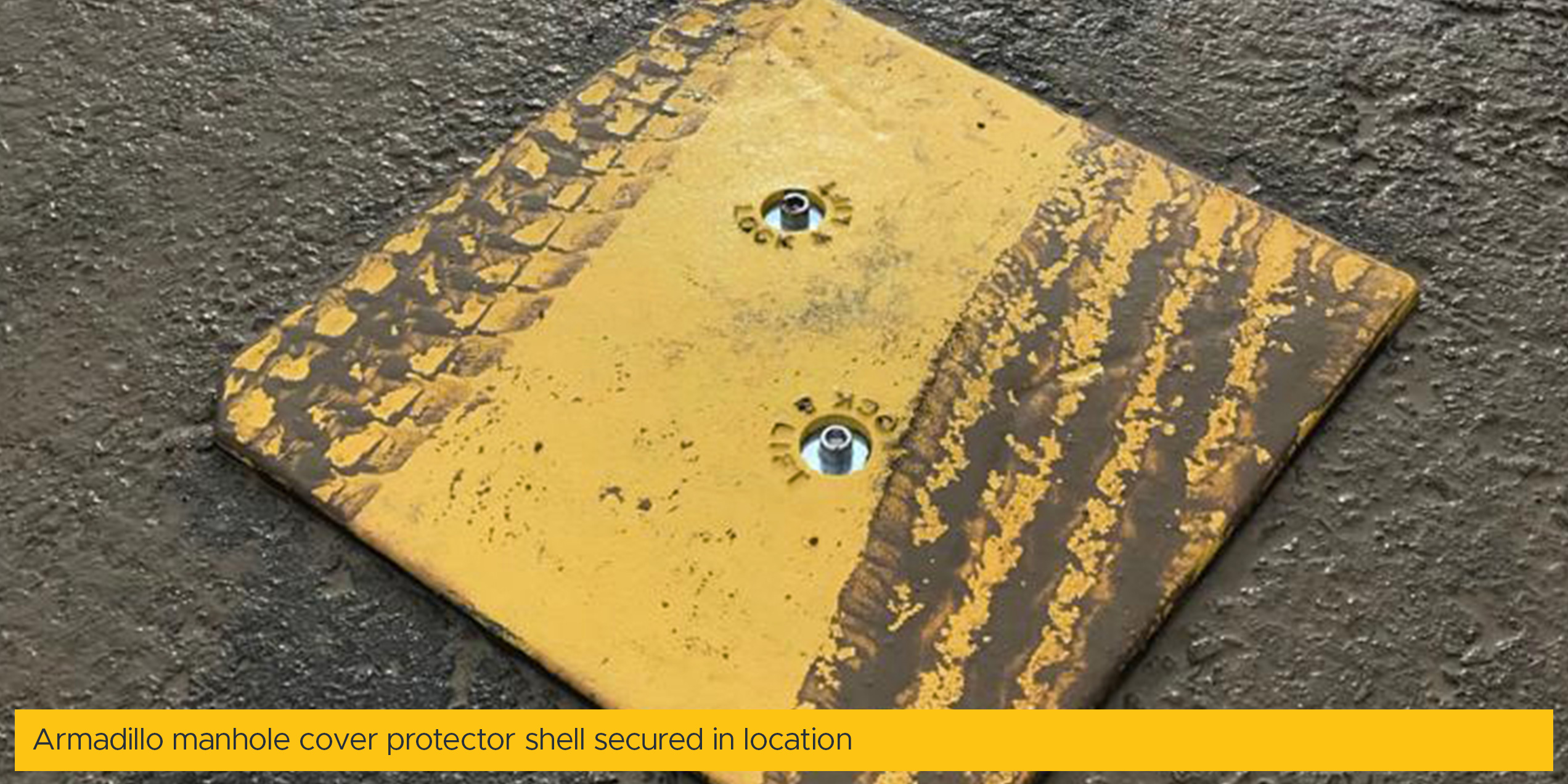 Armadillo manhole cover protector shell secured in location