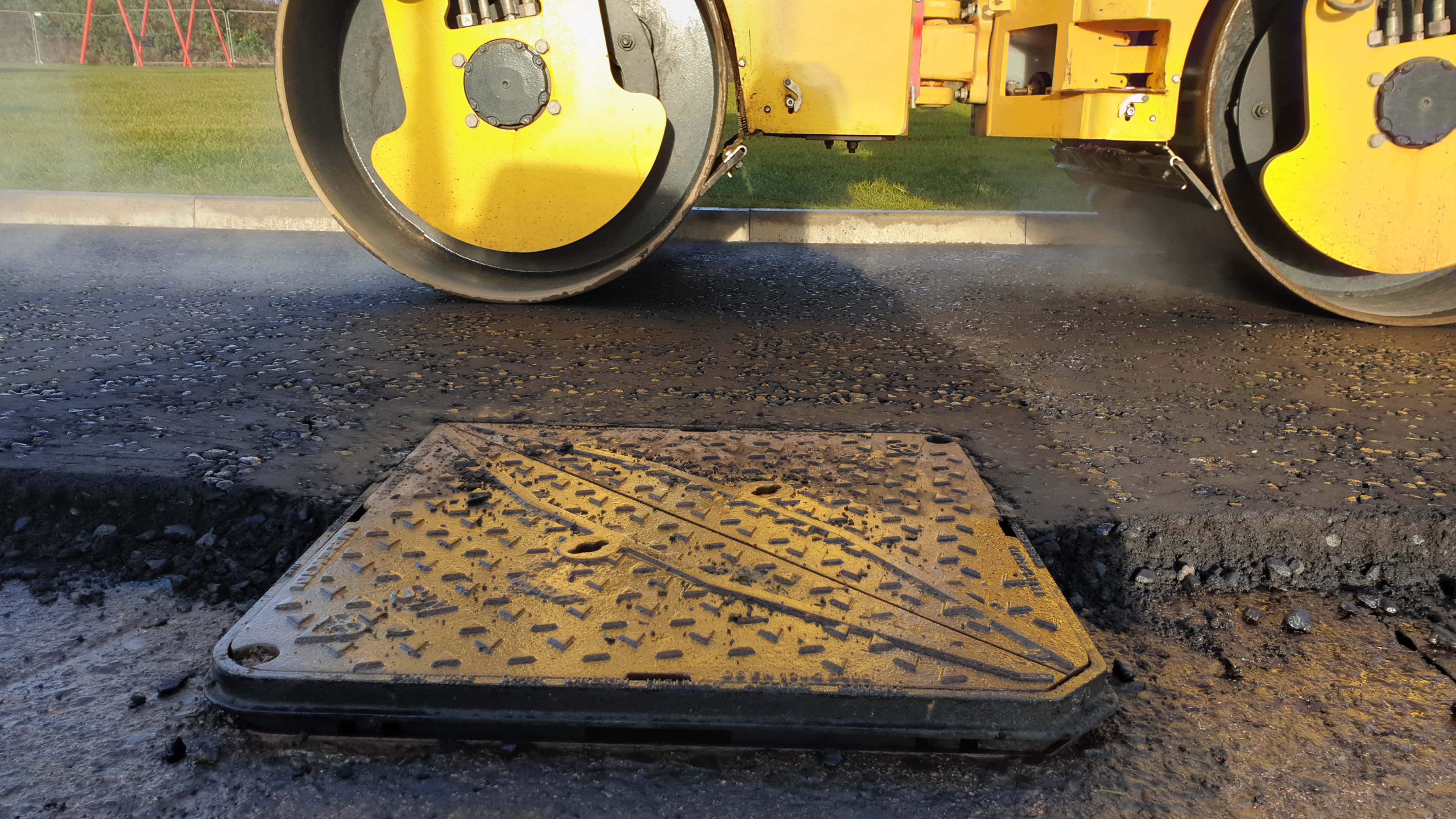 Tarmac being flattened and ClickLift installed with Manhole cover
