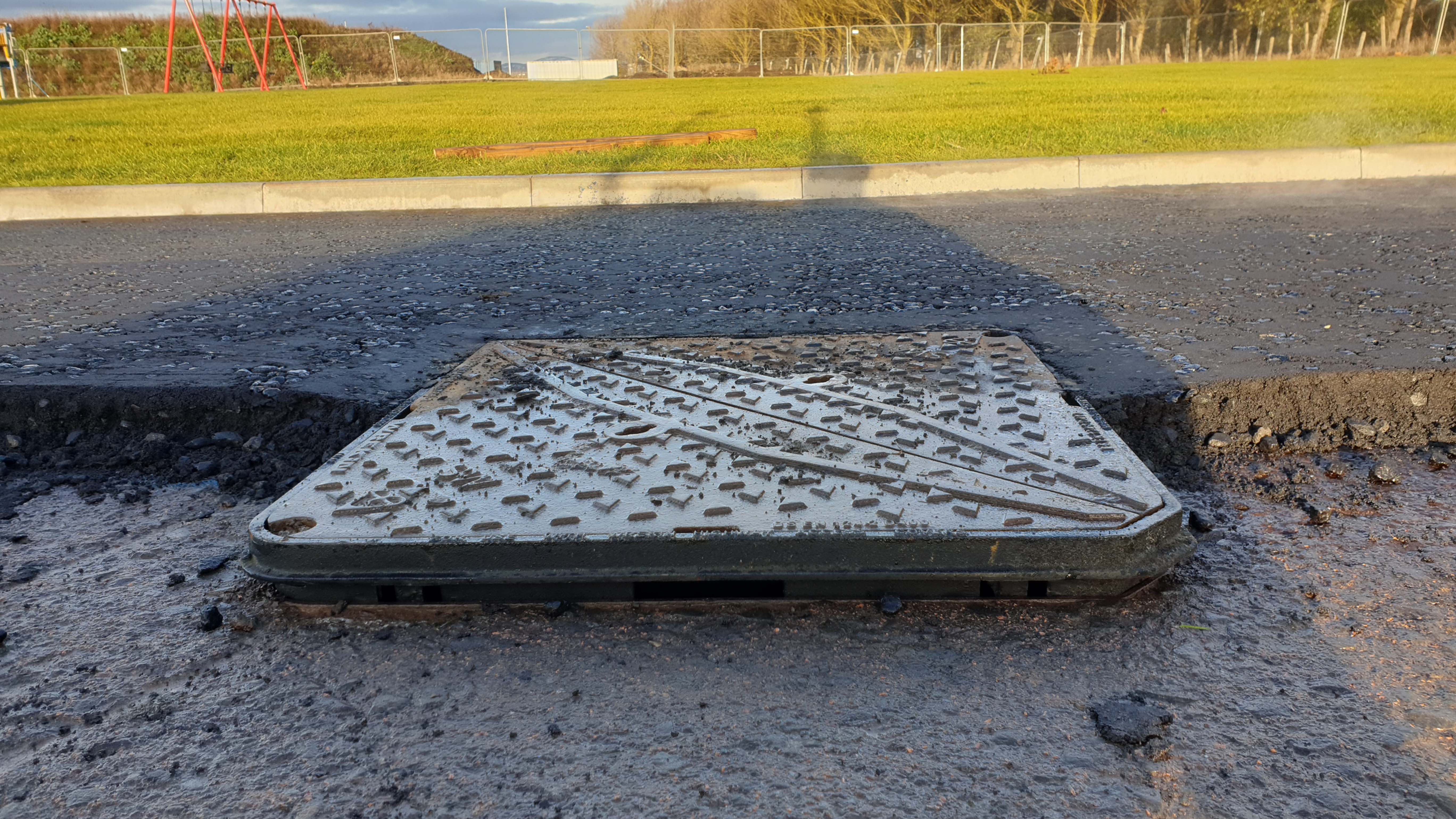 Road being tarmacked and ClickLift installed with Manhole cover