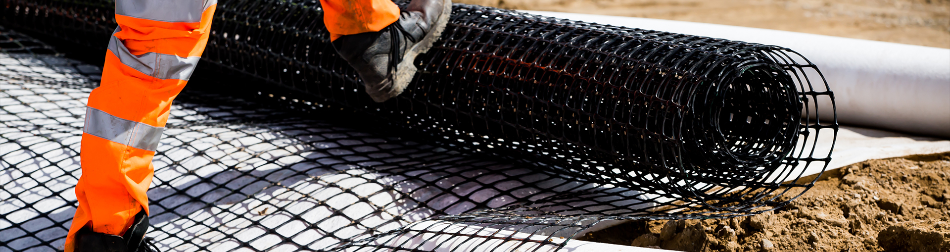 Geosynthetics roll being installed on construction site