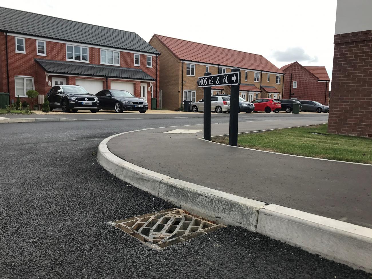 Highway D400 gully grate installed in road