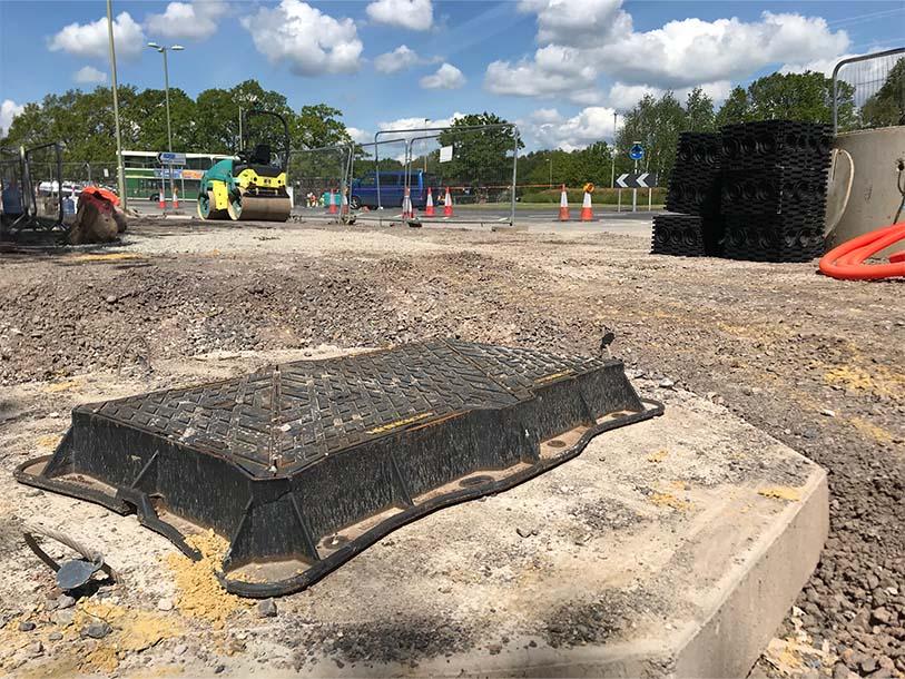 Unite manhole cover being installed