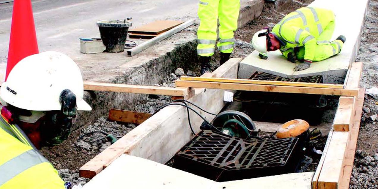 V Gully Grate being installed in motorway