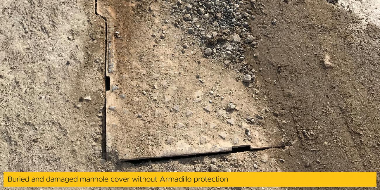Buried and damaged manhole cover without Armadillo protection