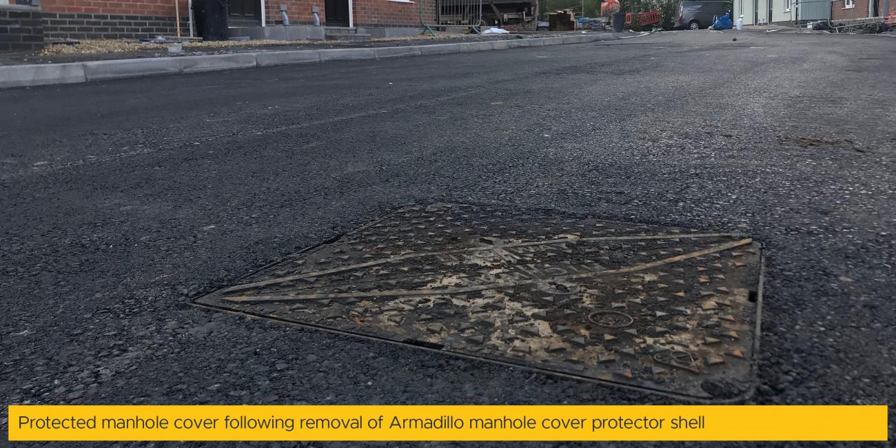 Protected manhole cover following removal of Armadillo manhole cover protector shell