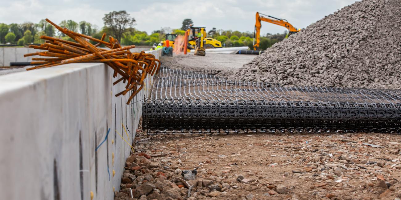 Geosynthetics roll being laid at Norwich North Recycling Centre