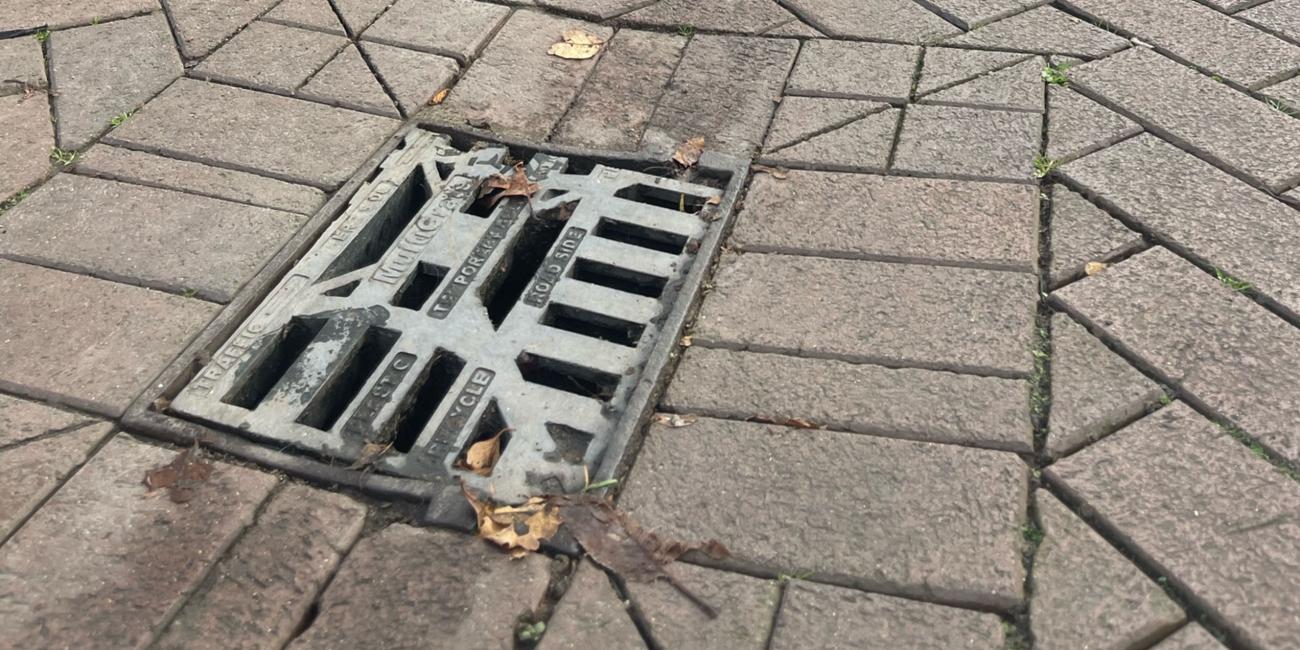 Multigrate being used as a temporary solution for gully grate in a block paviour