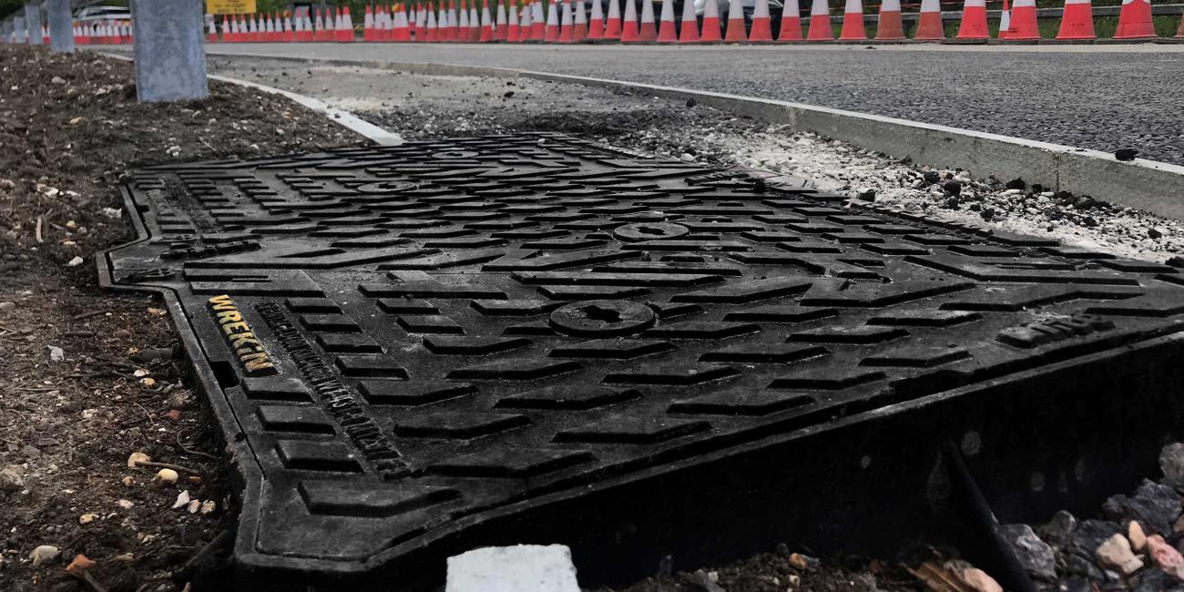 Unite manhole cover installed on M27