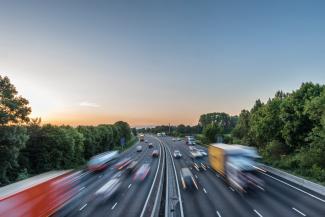 Cars and lorries driving on highway
