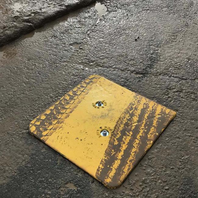Armadillo manhole cover protector installed on construction site