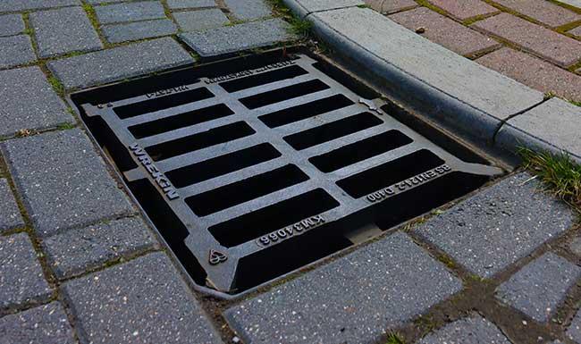 Tristar gully grate installed in a block paved road